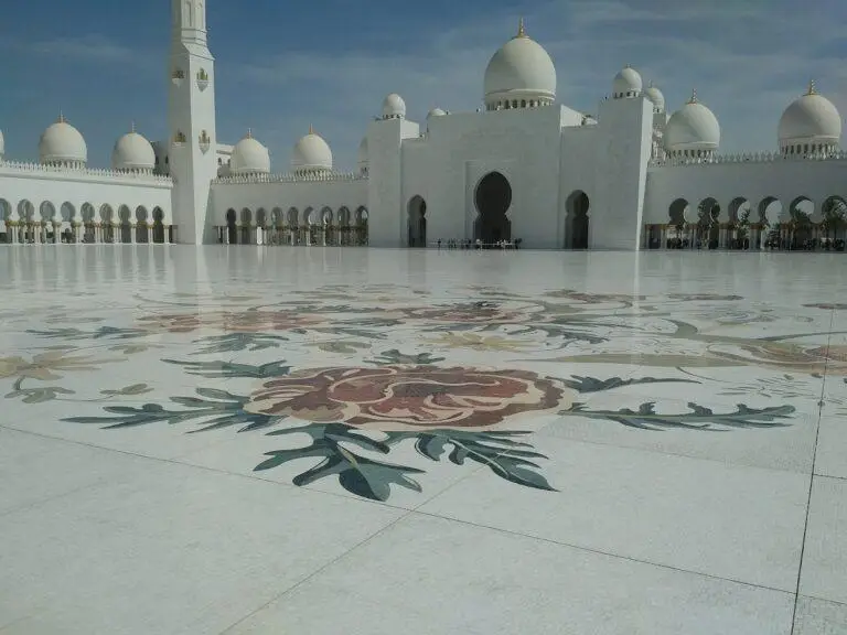Sheikh Zayed Grand Mosque courtyard with intricate floral marble designs in Abu Dhabi