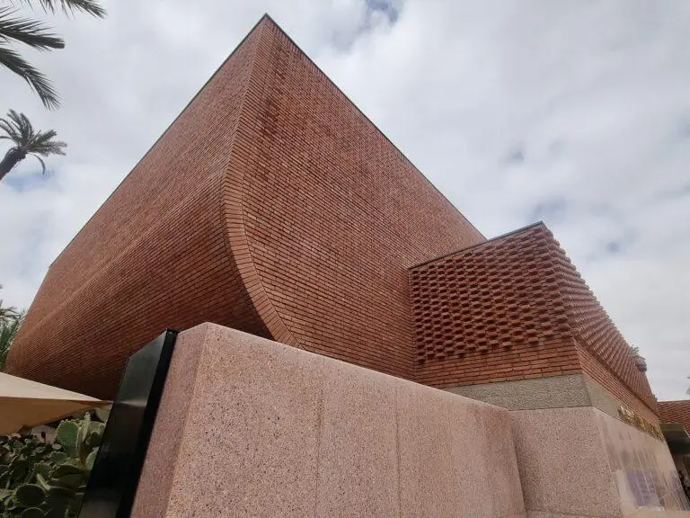 Yves Saint Laurent Museum in Marrakech, contemporary brick architecture designed by Studio KO, featuring sculptural form and textured brickwork.