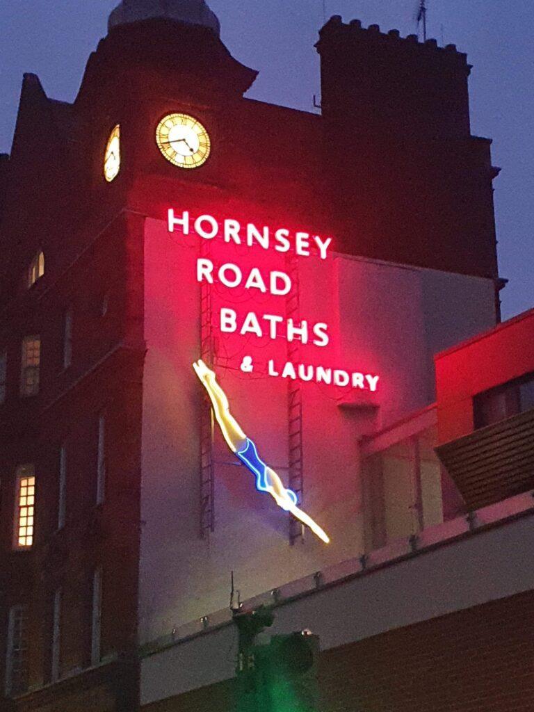 Hornsey Road Baths neon sign at night, North London